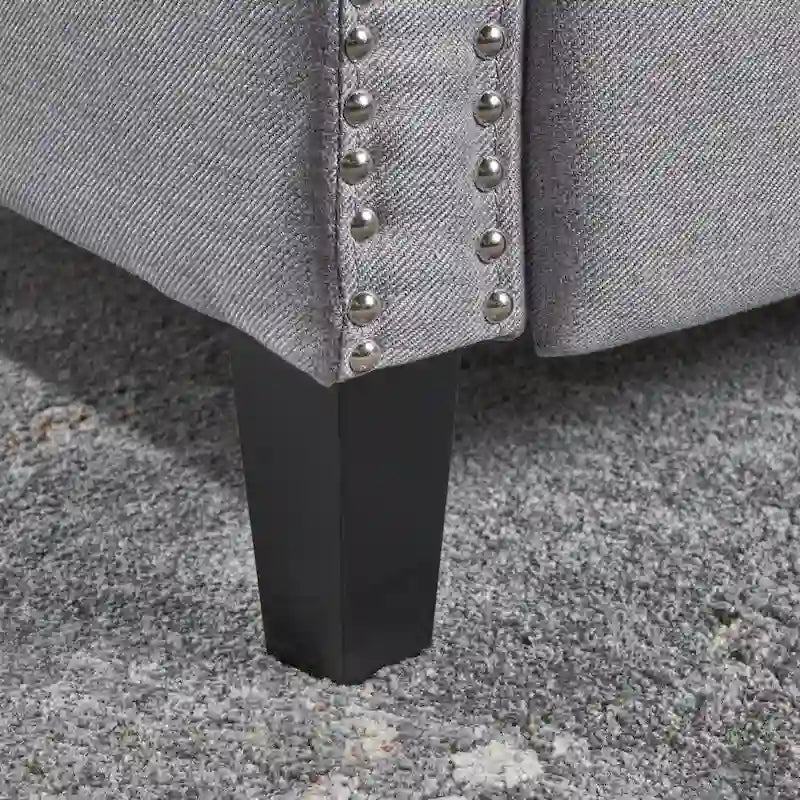 Fauteuil inclinable en tissu capitonné